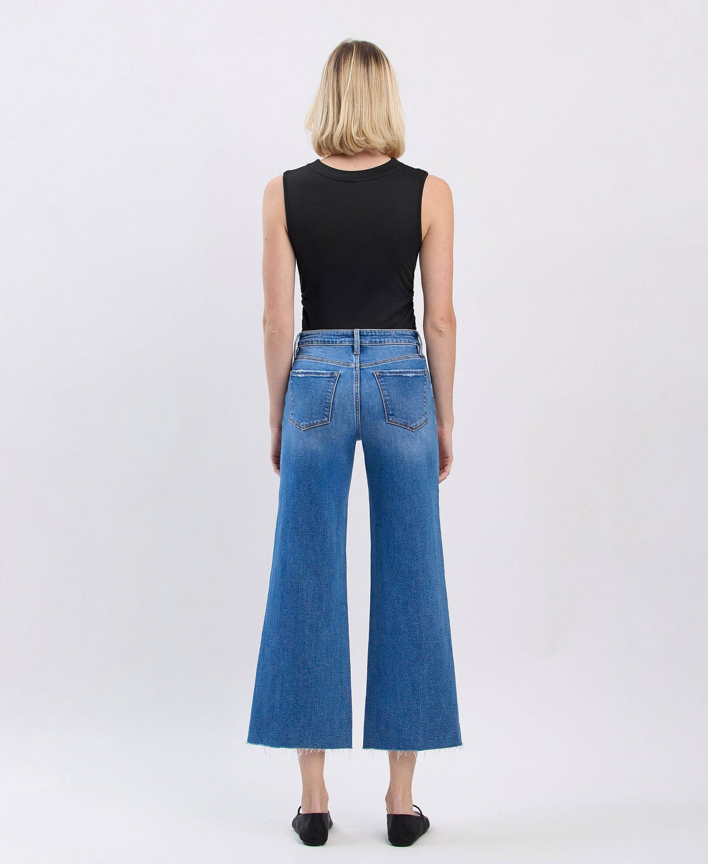 HIGH RISE RAW HEM TWIST WIDE JEANS