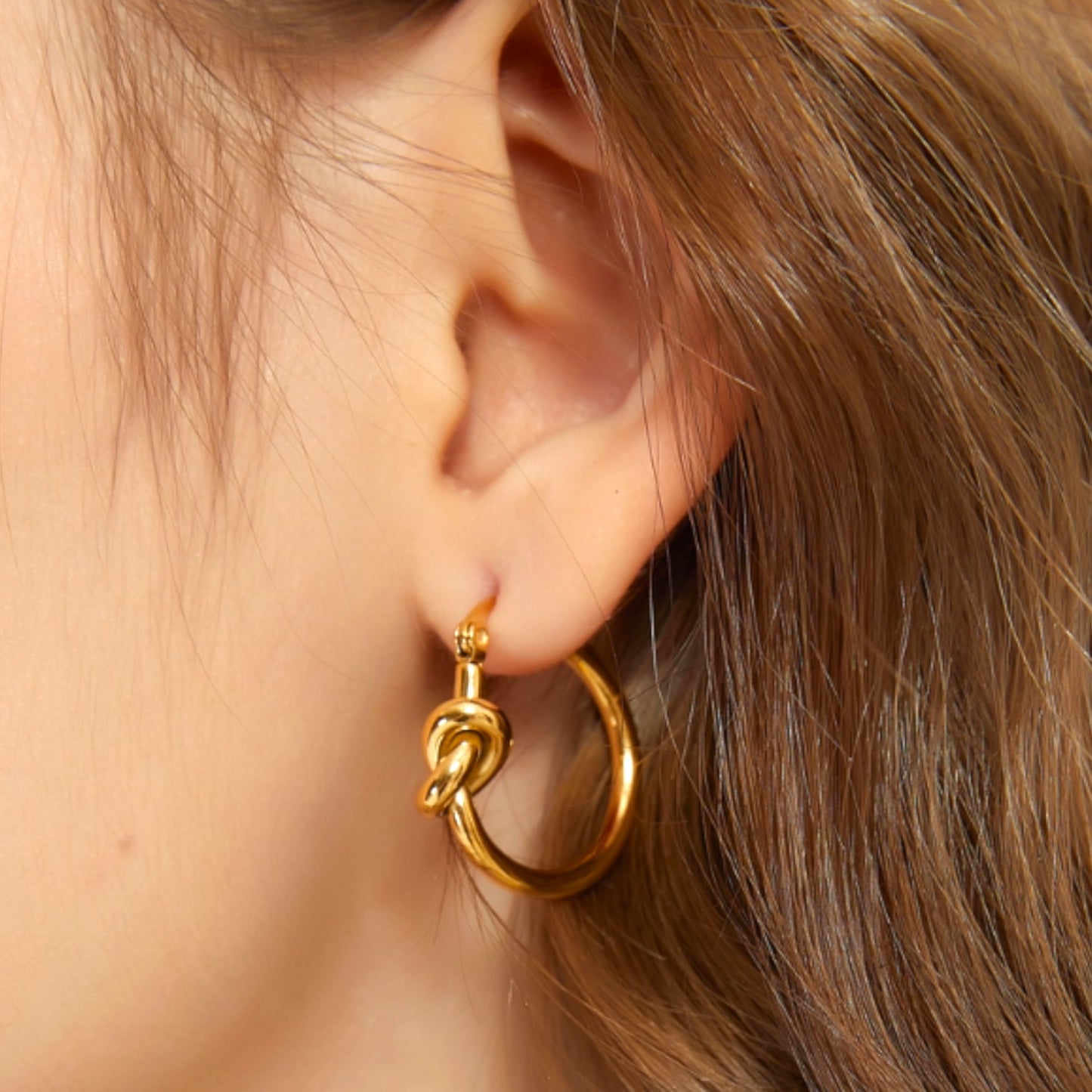 Knot Hoop Earrings in Gold and Silver